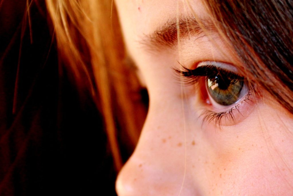 A close-up image of young girl's face in profile.