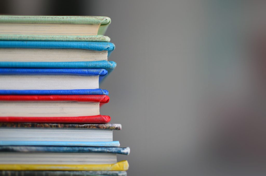 english-lesson-ideas: a stacked pile of colourful books.